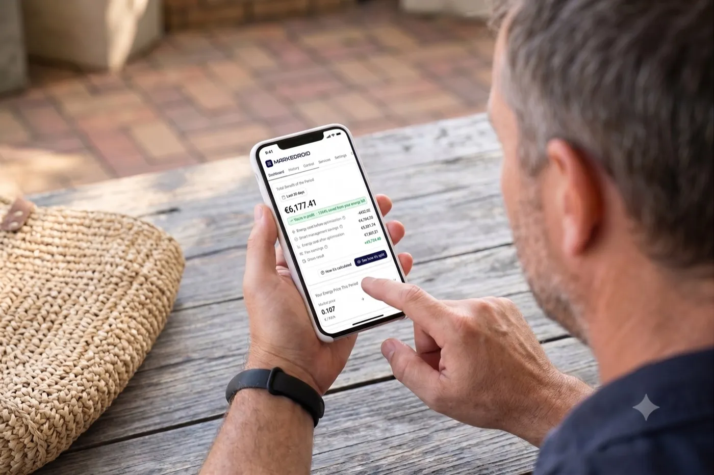 Homeowner checking the MarkeDroid app on their phone